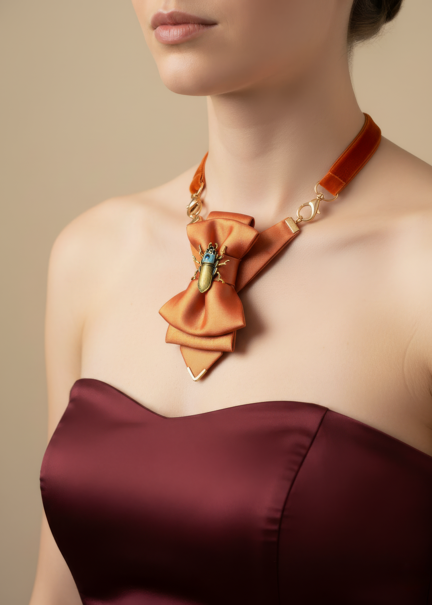 Orange Hopper tie for women, handmade orange bow tie necktie, artistic women’s neck accessory orange, luxury statement tie for women, orange and gold bow tie handmade, women’s summer neck accessory, unique women’s fashion accessory, wearable art tie for women, orange statement bow tie, adjustable hoop necktie for women, artistic women’s tie Lithuania, designer women’s bow tie orange, one of a kind women’s neck accessory