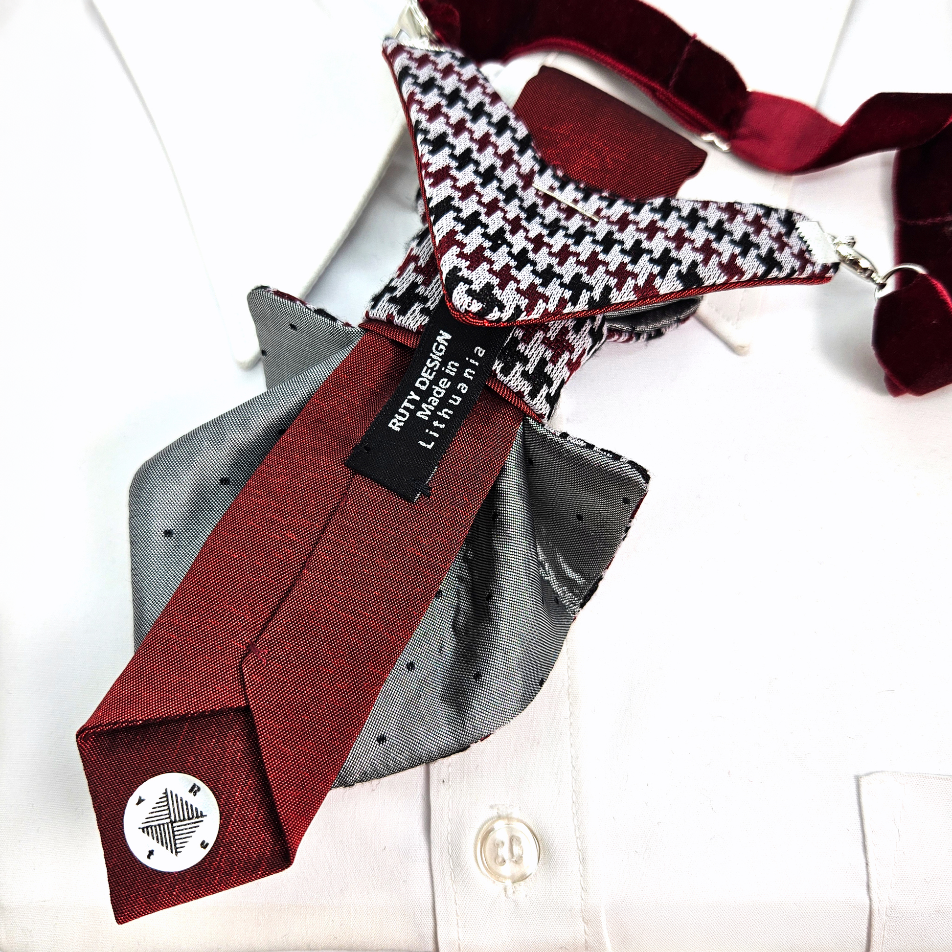 Collection of neckties with a houndstooth patterned tie on a white premium handmade knitted houndstooth tie in burgundy, luxury italian silk wool blend necktie with red pied-de-poule pattern, unique red and black patterned tie for wedding or business attire, close-up of high-quality wool knit scarf style tie with abstract design, elegant burgundy and black dogtooth pattbackground