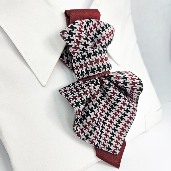 Houndstooth patterned scarf with red trim on a white background premium handmade knitted houndstooth tie in burgundy, luxury italian silk wool blend necktie with red pied-de-poule pattern, unique red and black patterned tie for wedding or business attire, close-up of high-quality wool knit scarf style tie with abstract design, elegant burgundy and black dogtooth patt
