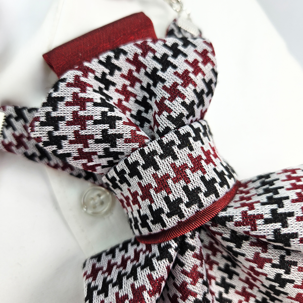Houndstooth patterned bow tie with red accents on a white shirt premium handmade knitted houndstooth tie in burgundy, luxury italian silk wool blend necktie with red pied-de-poule pattern, unique red and black patterned tie for wedding or business attire, close-up of high-quality wool knit scarf style tie with abstract design, elegant burgundy and black dogtooth patt