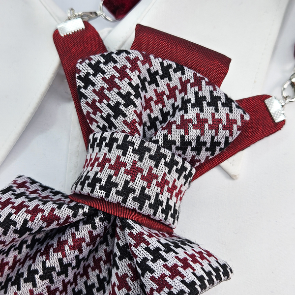 Houndstooth patterned bow tie with red accents on a white background premium handmade knitted houndstooth tie in burgundy, luxury italian silk wool blend necktie with red pied-de-poule pattern, unique red and black patterned tie for wedding or business attire, close-up of high-quality wool knit scarf style tie with abstract design, elegant burgundy and black dogtooth patt