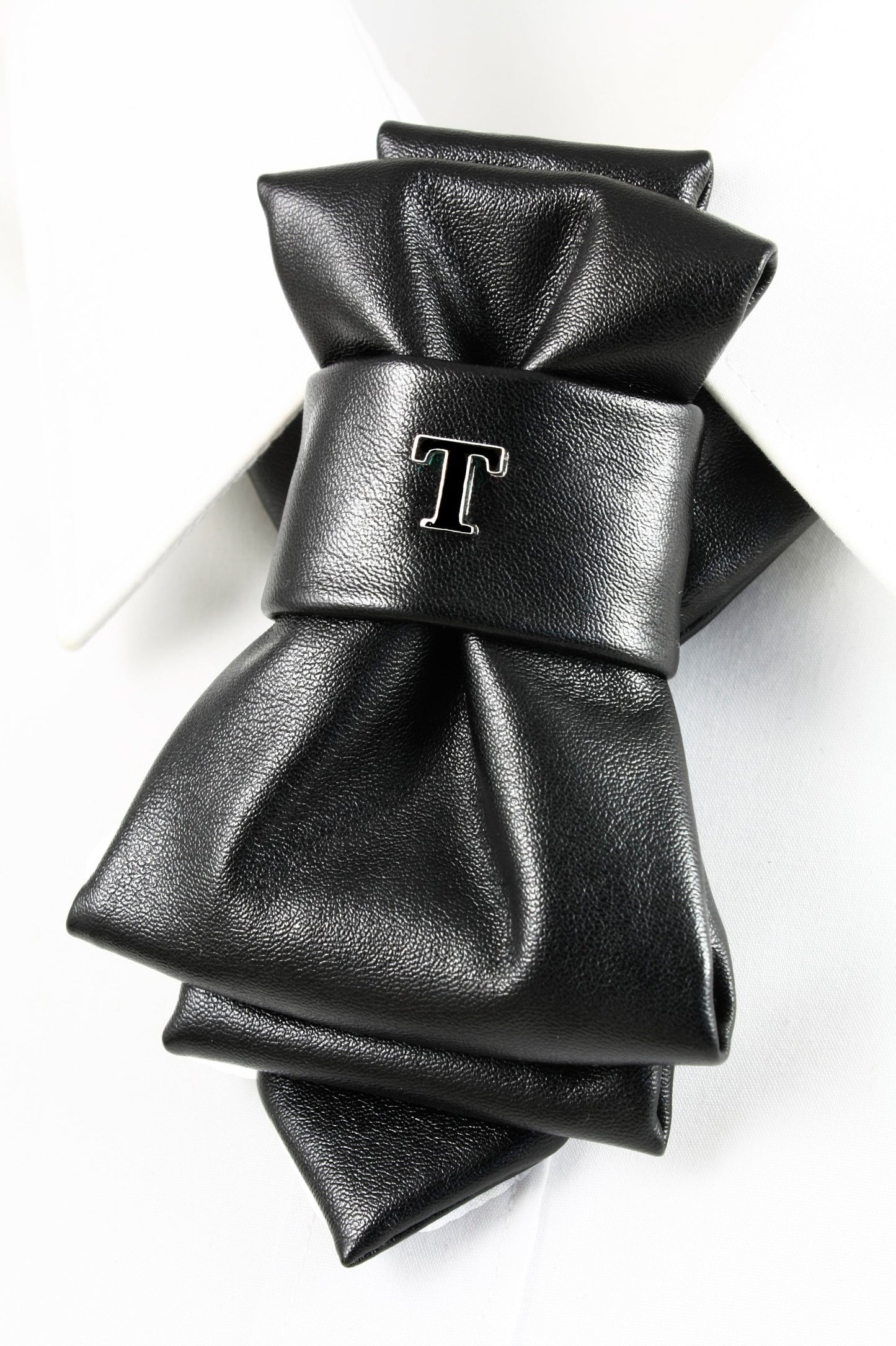 black faux leather bow tie, biker style bow tie, vertical bow tie design, black synthetic leather necktie, edgy men bow tie, unisex bow tie accessory, handmade leather look bow tie, modern statement bow tie, alternative fashion neckwear, biker inspired bow tie, wedding bow tie black, groomsmen bow tie unique, christmas party bow tie, formal leather style bow tie, minimalist black bow tie, stylish men neck accessory, women bow tie fashion, luxury faux leather bow tie