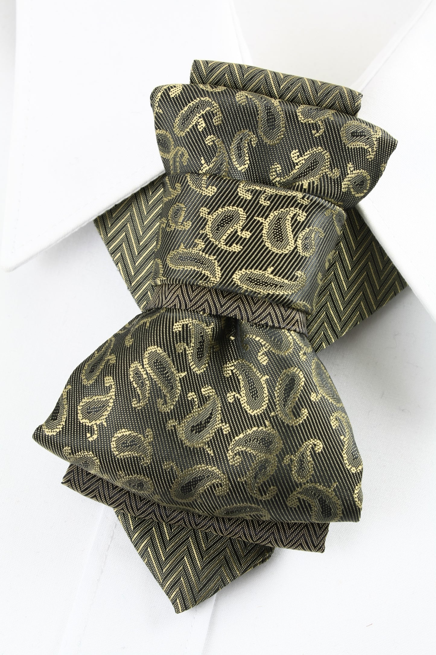 Bow Tie, Tie for wedding suite SAFARI hopper tie Bow tie 
A black and gold silk ascot tie with a detailed paisley pattern, worn with a classic white dress shirt. The tie features a chevron stripe texture, creating a sophisticated and formal look. It's a handmade luxury wedding accessory