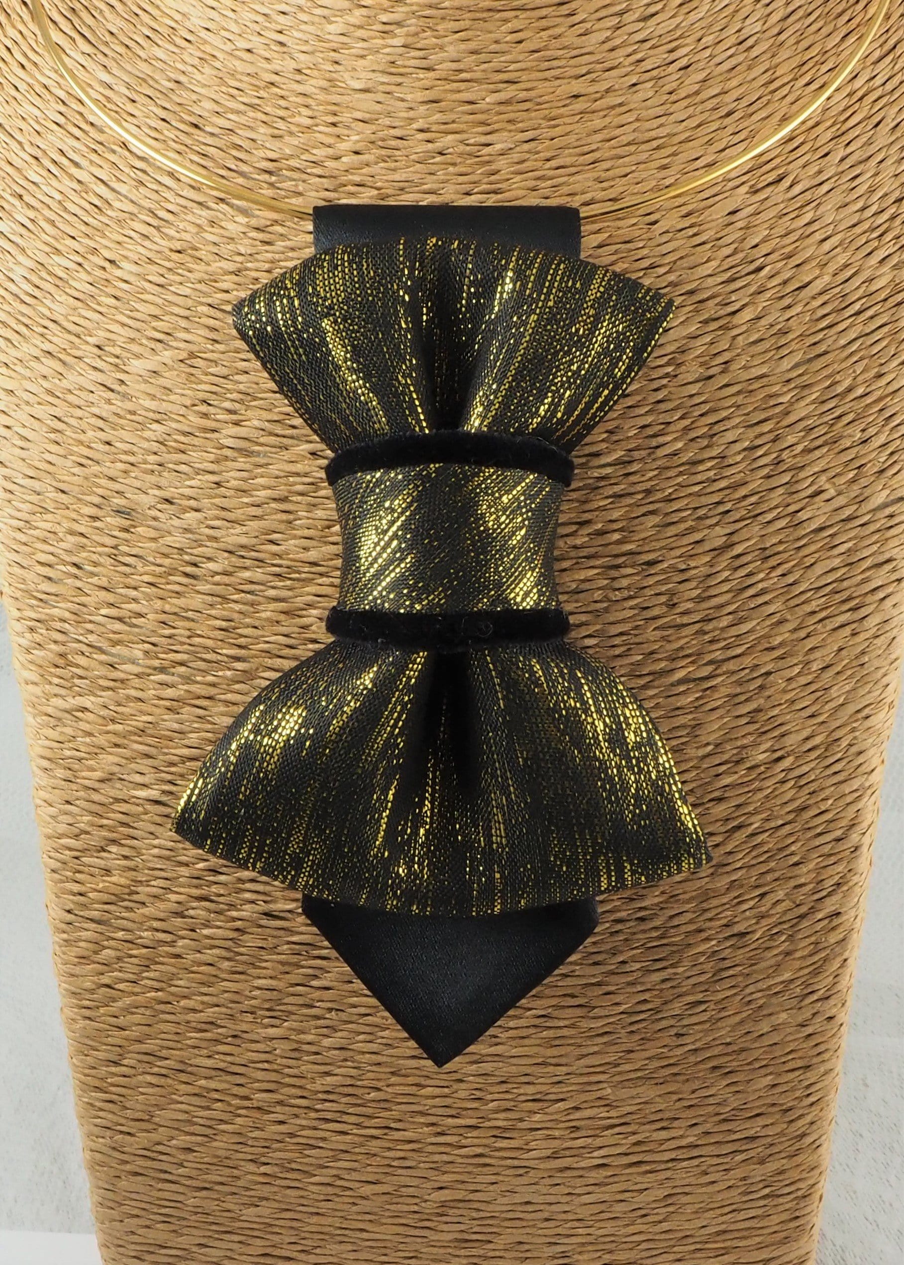 black gold womens necktie, luxury necktie for women, handmade necktie, statement accessory, elegant womens tie, unique gift for her, versatile neckwear, brooch pendant tie, modern necktie, Rūta Piekurienė design, Lithuanian handmade tie, formal accessory women, artistic necktie, special occasion tie, fashion tie for women, pre tied womens necktie, designer neckwear, black and gold tie, edgy womens fashion, dressy necktie HOPPER TIE THE GOLDEN FOR LADY.