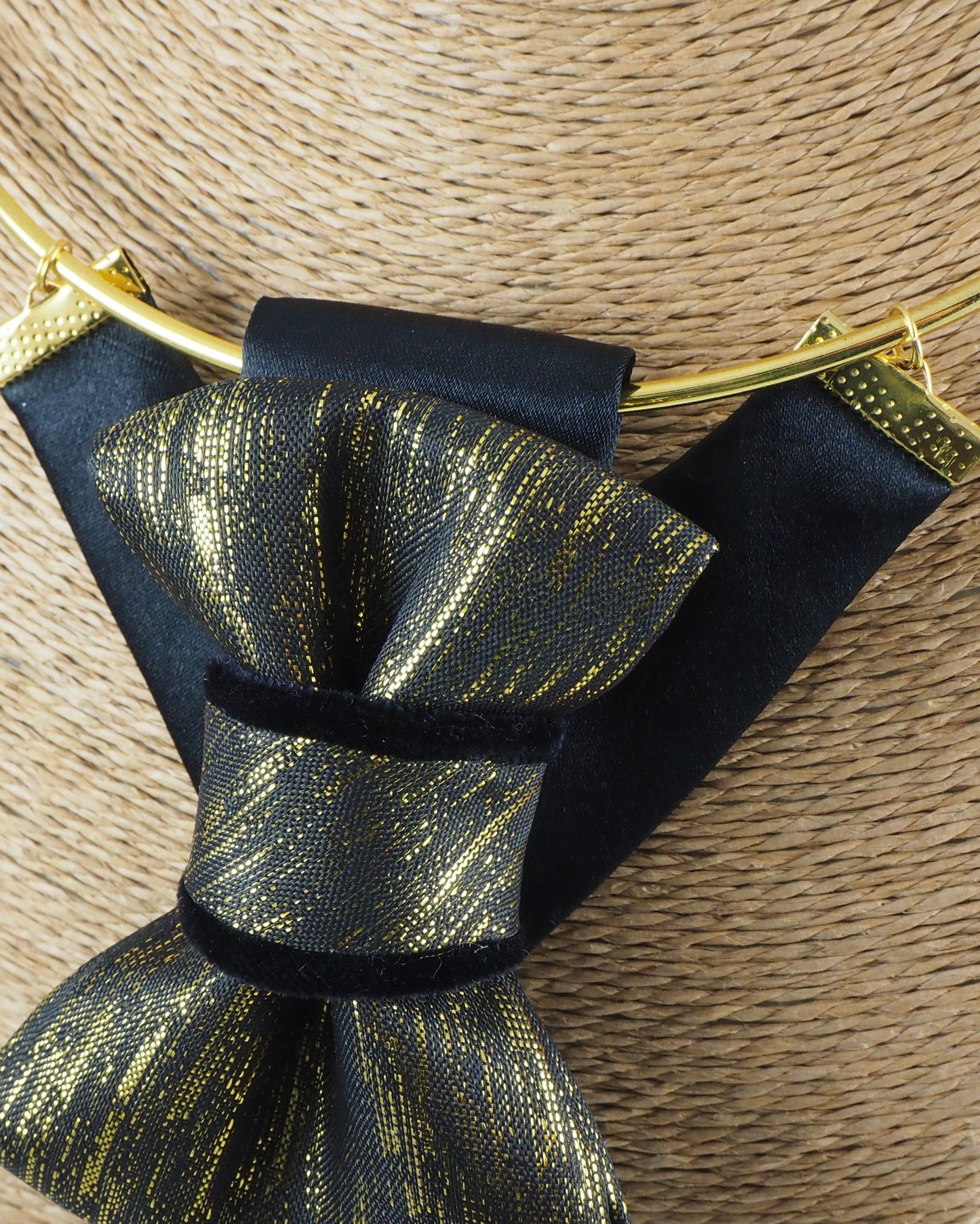 black gold womens necktie, luxury necktie for women, handmade necktie, statement accessory, elegant womens tie, unique gift for her, versatile neckwear, brooch pendant tie, modern necktie, Rūta Piekurienė design, Lithuanian handmade tie, formal accessory women, artistic necktie, special occasion tie, fashion tie for women, pre tied womens necktie, designer neckwear, black and gold tie, edgy womens fashion, dressy necktie HOPPER TIE THE GOLDEN FOR LADY.
