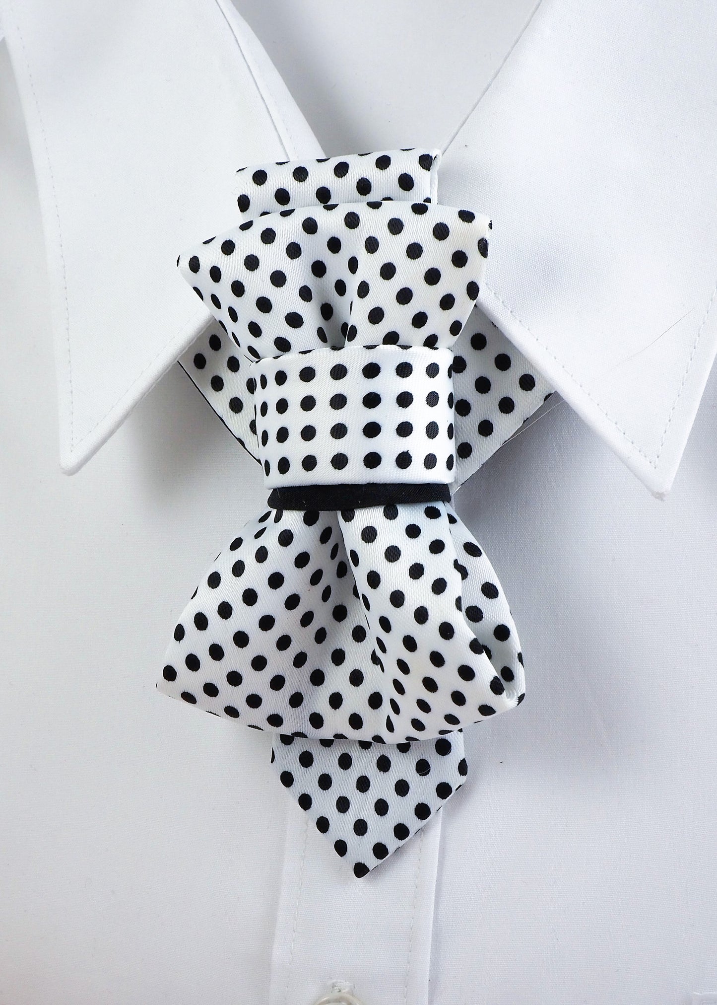 White necktie with black polka dots, short handmade luxury design for women

Elegant women's necktie, white with black dots, artistic modern accessory

Handmade polka dot necktie, unique fashion tie for stylish women

Short necktie for women, white fabric with black polka dots, chic and bold

Luxury necktie alternative to bow tie, handmade for modern elegant style

Black and white polka dot tie, artistic neck accessory for women

Unique wmen’s tie, white with black dots, formal and creative fashion piece

