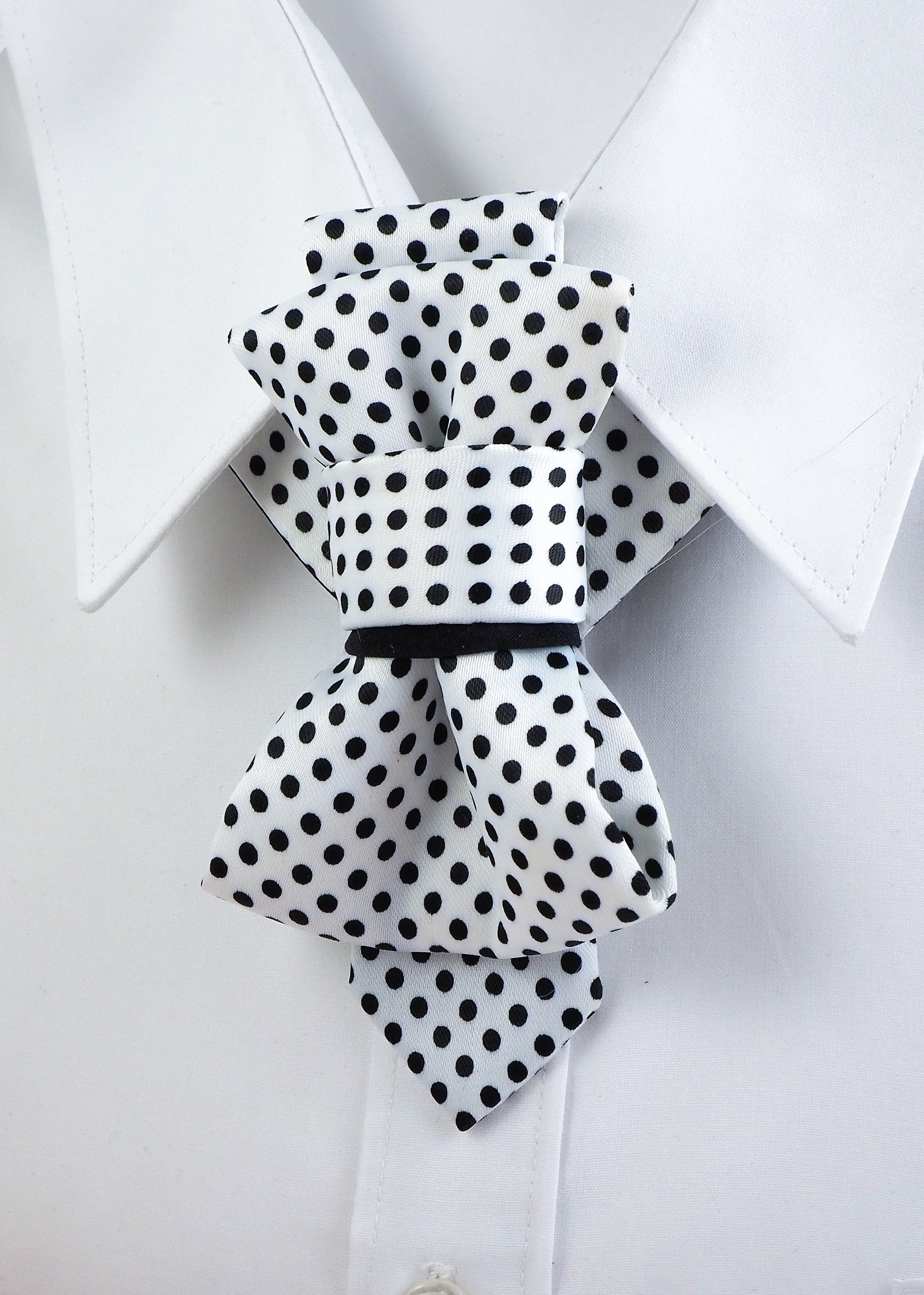 White necktie with black polka dots, short handmade luxury design for women

Elegant women's necktie, white with black dots, artistic modern accessory

Handmade polka dot necktie, unique fashion tie for stylish women

Short necktie for women, white fabric with black polka dots, chic and bold

Luxury necktie alternative to bow tie, handmade for modern elegant style

Black and white polka dot tie, artistic neck accessory for women

Unique wmen’s tie, white with black dots, formal and creative fashion piece

