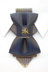 Bow tie "Vilnius 700",Bow tie "Vilnius 700" is a work, dedicated to the birthday of Vilnius, the capital of Lithuania.  Brass Vytis adorns the original knot of three fabrics.