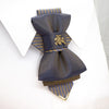 Bow tie "Vilnius 700",Bow tie "Vilnius 700" is a work, dedicated to the birthday of Vilnius, the capital of Lithuania.  Brass Vytis adorns the original knot of three fabrics.