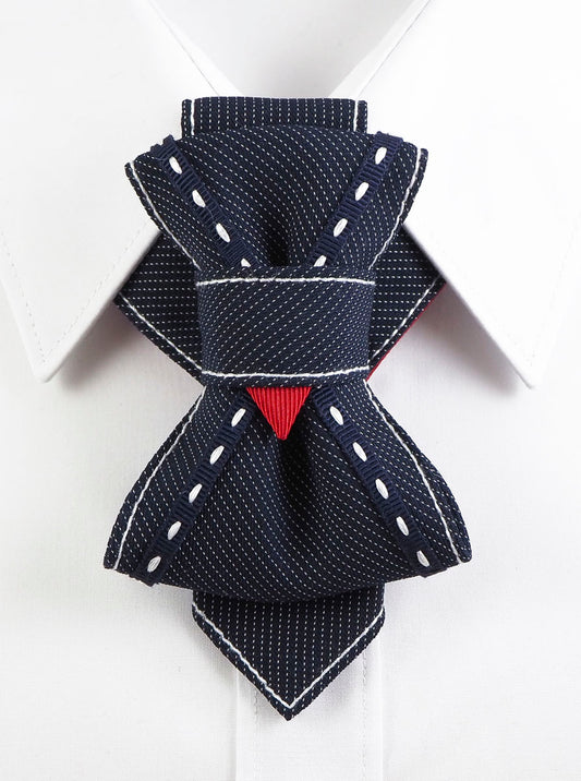 Bow Tie, Tie for wedding suite WINSTON hopper tie Bow tie, Handmade luxury tie "Wilson" with layered navy design and red accent

Unique wedding tie for men with white stitching and folded structure

Artistic necktie for groom – navy with fine pinstripes and red detail

"Wilson" designer necktie with geometric knot and bold statement look

Formal men’s accessory – navy handmade tie with contrast thread

Unisex sculptural tie with modern twist for weddings and performances

Luxury groom tie by Rūta Piekurienė