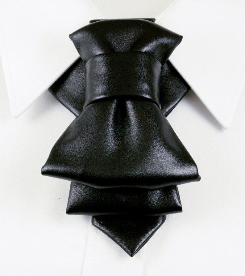 black faux leather bow tie, biker style bow tie, vertical bow tie design, black synthetic leather necktie, edgy men bow tie, unisex bow tie accessory, handmade leather look bow tie, modern statement bow tie, alternative fashion neckwear, biker inspired bow tie, wedding bow tie black, groomsmen bow tie unique, christmas party bow tie, formal leather style bow tie, minimalist black bow tie, stylish men neck accessory, women bow tie fashion, luxury faux leather bow tie